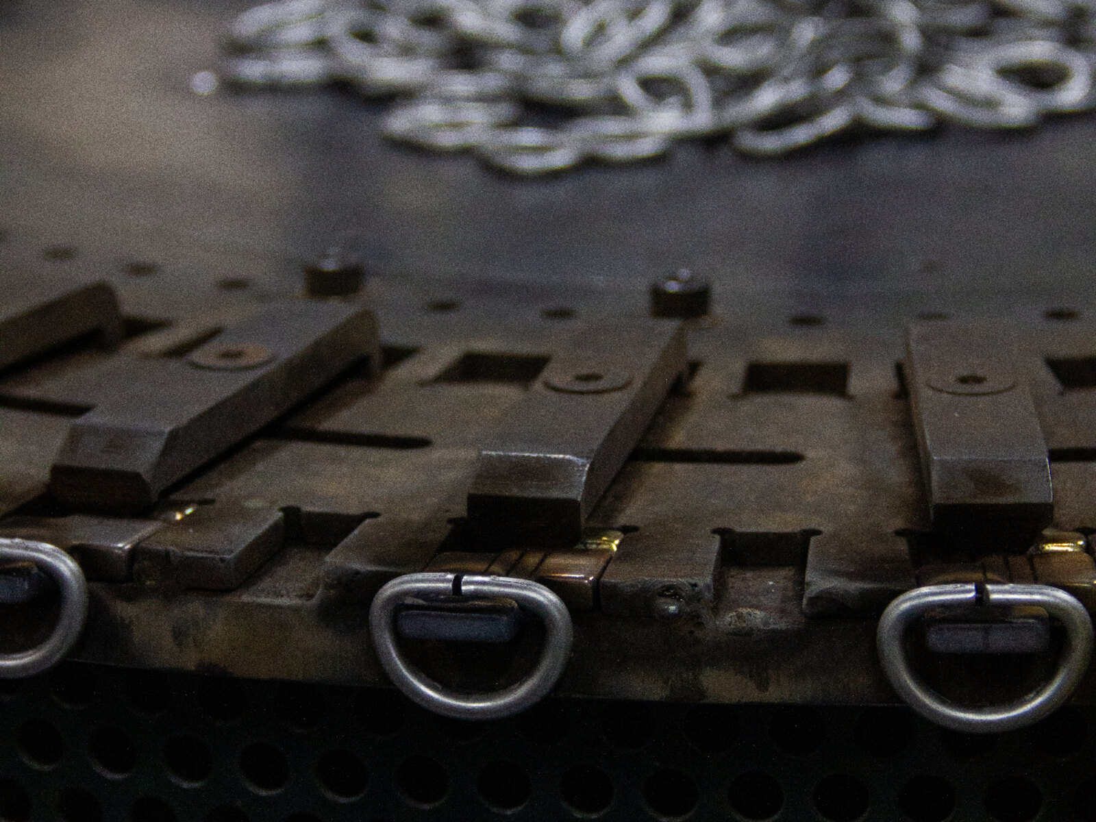 Fabrication bench with D-ring lashing hardware ready for assembly at the Makefast factory